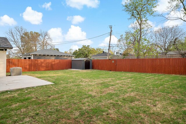 9035 Leaside Dr, Dallas, TX 75238 - view of yard with central AC, a storage unit, a patio area, and an outbuilding