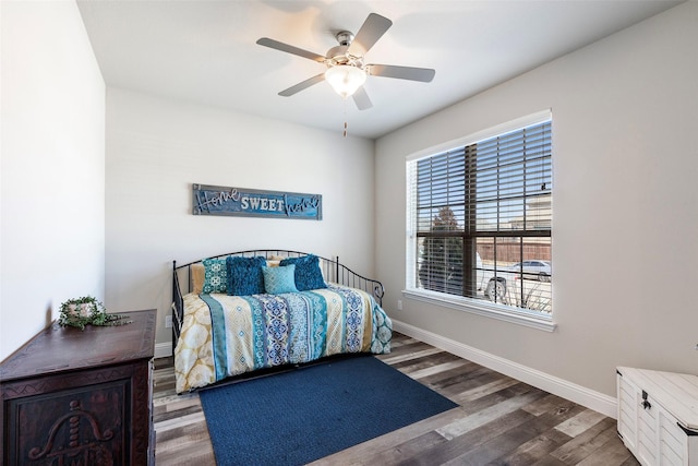 5841 Willow Ln, The Colony, TX 75056 - bedroom featuring baseboards, wood finished floors, and ceiling fan