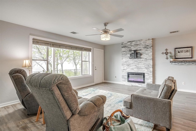 living room with baseboards and visible vents