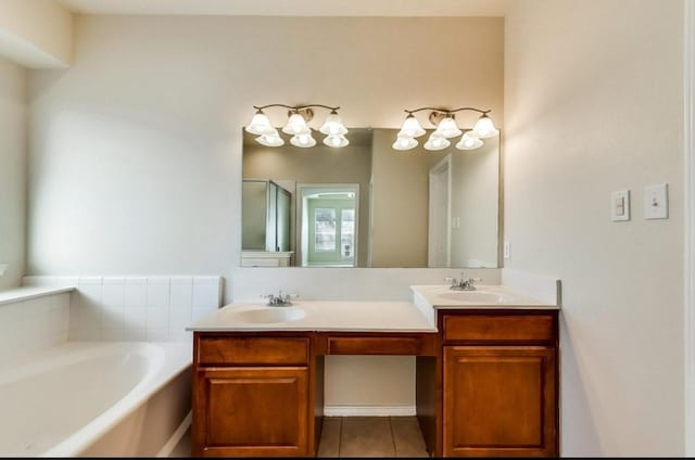 bathroom with a sink, double vanity, a stall shower, a bath, and tile patterned floors