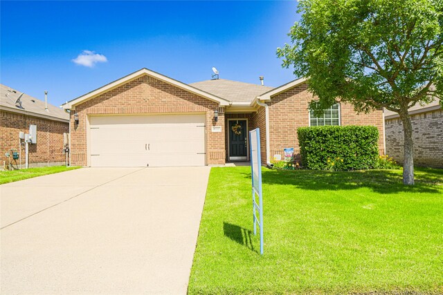 2122 Bluebell, Forney, TX 75126 - single story home with concrete driveway, an attached garage, brick siding, and a front lawn