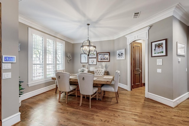 931 Willow Ct, Fairview, TX 75069 - dining space featuring baseboards, light wood finished floors, plenty of natural light, a chandelier, and ornamental molding