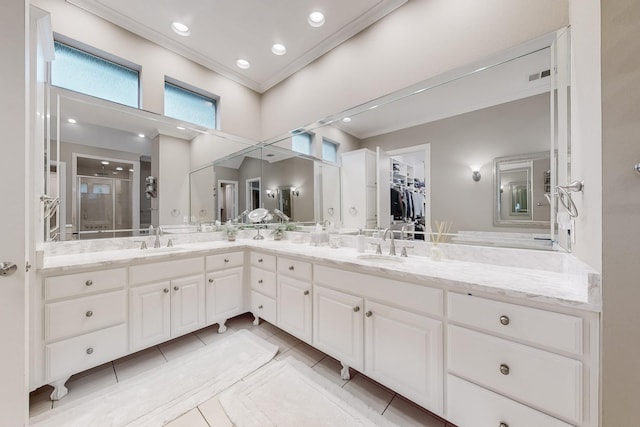 931 Willow Ct, Fairview, TX 75069 - bathroom with ornamental molding, double vanity, tile patterned floors, a stall shower, and a spacious closet