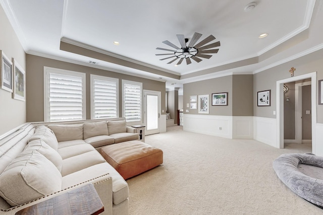 931 Willow Ct, Fairview, TX 75069 - living area with a tray ceiling, ceiling fan, ornamental molding, light carpet, and a wainscoted wall