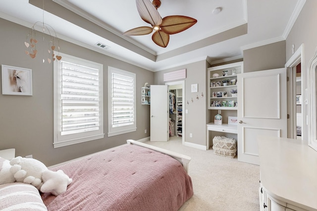 931 Willow Ct, Fairview, TX 75069 - bedroom featuring carpet floors, a spacious closet, ornamental molding, a tray ceiling, and ceiling fan