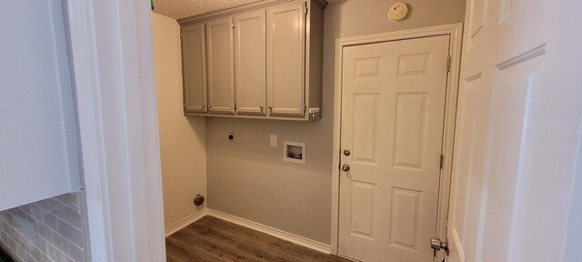 295 Goodnight Trl, Rhome, TX 76078 - laundry room with hookup for a washing machine, hookup for an electric dryer, baseboards, cabinet space, and dark wood-style flooring