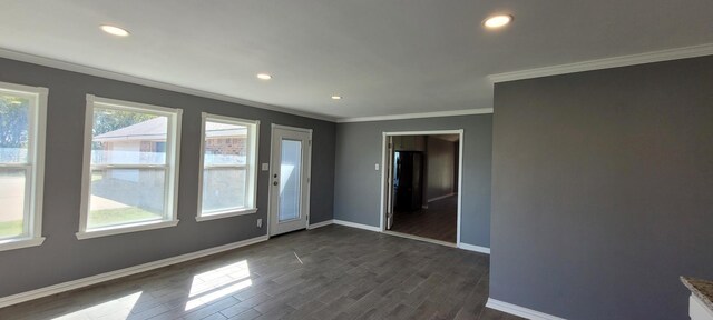 295 Goodnight Trl, Rhome, TX 76078 - spare room featuring ornamental molding, dark wood-style floors, baseboards, and recessed lighting