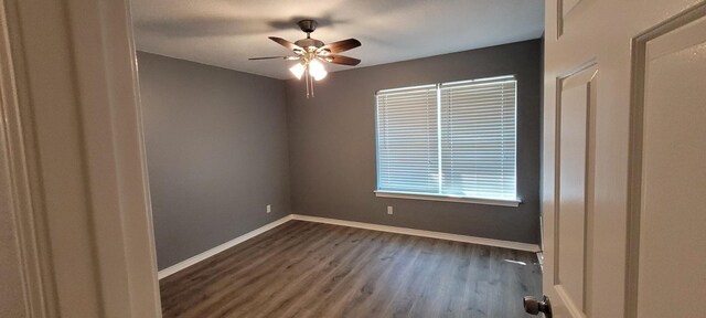 295 Goodnight Trl, Rhome, TX 76078 - spare room featuring wood finished floors, baseboards, and ceiling fan
