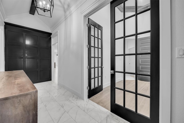 1661 Ethan Cir, Midlothian, TX 76065 - foyer with light marble finish floors, ornamental molding, a decorative wall, a chandelier, and vaulted ceiling