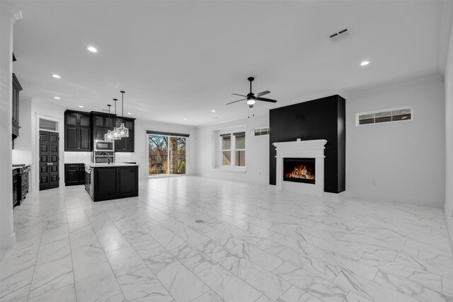 1661 Ethan Cir, Midlothian, TX 76065 - unfurnished living room with a lit fireplace, recessed lighting, ceiling fan, and light marble finish floors