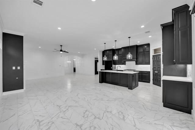 1661 Ethan Cir, Midlothian, TX 76065 - kitchen with light countertops, recessed lighting, open floor plan, light marble finish flooring, and decorative backsplash