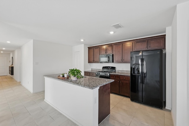 6436 Auburn Dale Rd, Pilot Point, TX 76258 - kitchen with black appliances, light stone countertops, a kitchen island, recessed lighting, and dark brown cabinets