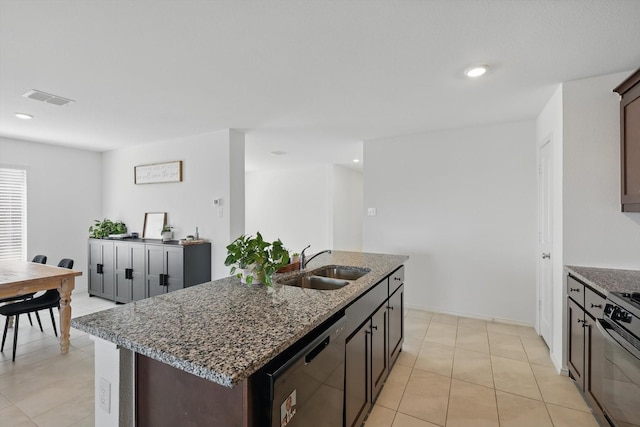 6436 Auburn Dale Rd, Pilot Point, TX 76258 - kitchen with a sink, dishwashing machine, dark stone counters, light tile patterned floors, and range with gas cooktop