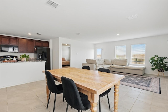 6436 Auburn Dale Rd, Pilot Point, TX 76258 - dining space with light tile patterned floors and recessed lighting