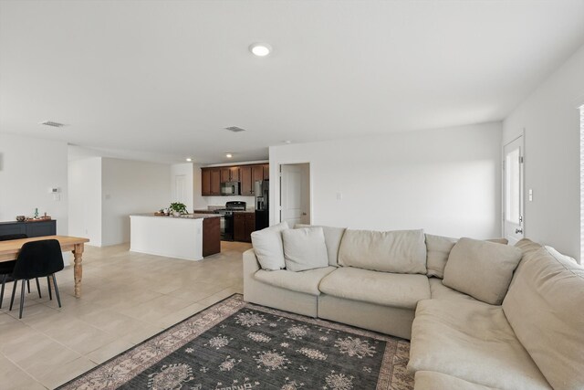 6436 Auburn Dale Rd, Pilot Point, TX 76258 - living area with light tile patterned flooring and recessed lighting