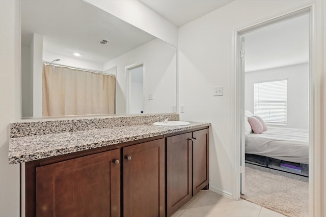 6436 Auburn Dale Rd, Pilot Point, TX 76258 - ensuite bathroom featuring vanity, tile patterned flooring, and baseboards