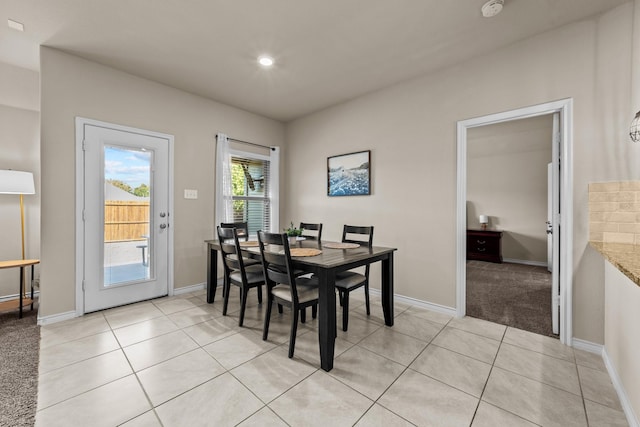 dining space with baseboards, recessed lighting, and light tile patterned floors
