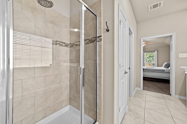 ensuite bathroom featuring ensuite bathroom, visible vents, a stall shower, and tile patterned floors