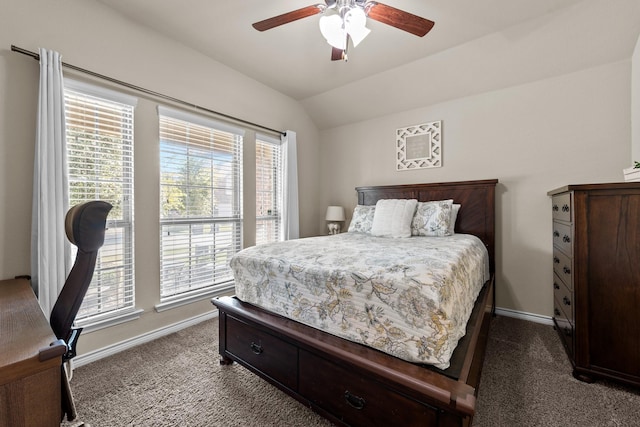 bedroom featuring baseboards, lofted ceiling, ceiling fan, and dark carpet