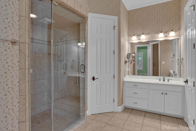 full bathroom featuring a stall shower, wallpapered walls, ornamental molding, and vanity