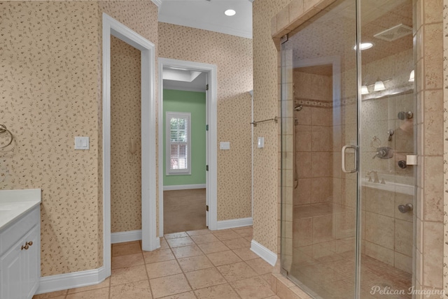 full bath with a shower stall, wallpapered walls, and visible vents