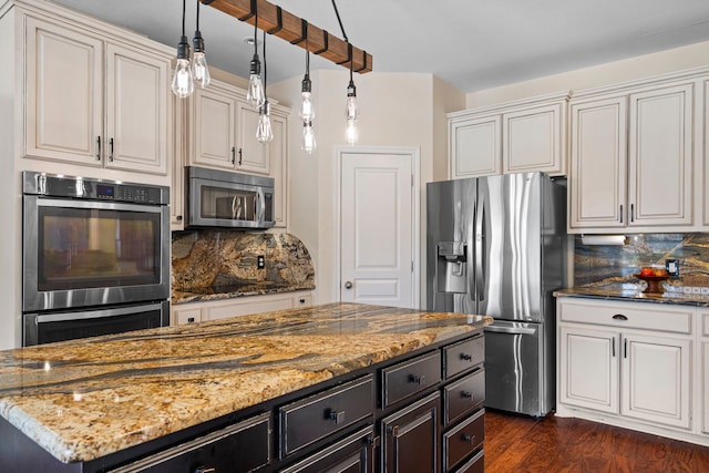 kitchen with decorative backsplash, dark wood-style floors, stainless steel appliances, and light stone countertops