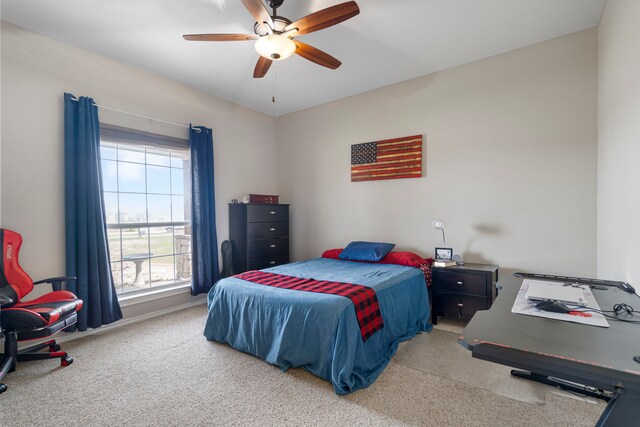 bedroom with baseboards, ceiling fan, and carpet flooring