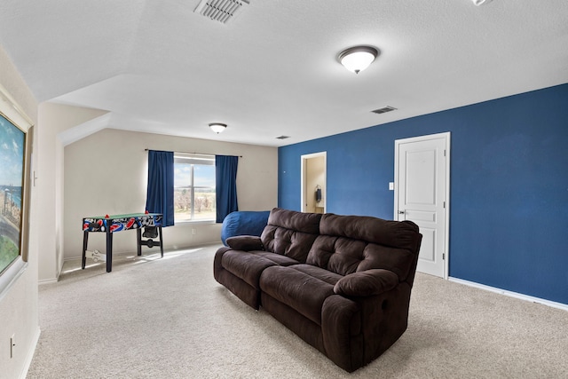 living area with baseboards, visible vents, and carpet flooring