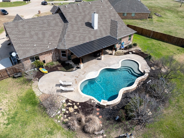 view of pool with a fenced backyard, a fenced in pool, a lawn, and a patio