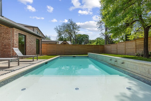 view of swimming pool featuring a fenced in pool and a fenced backyard