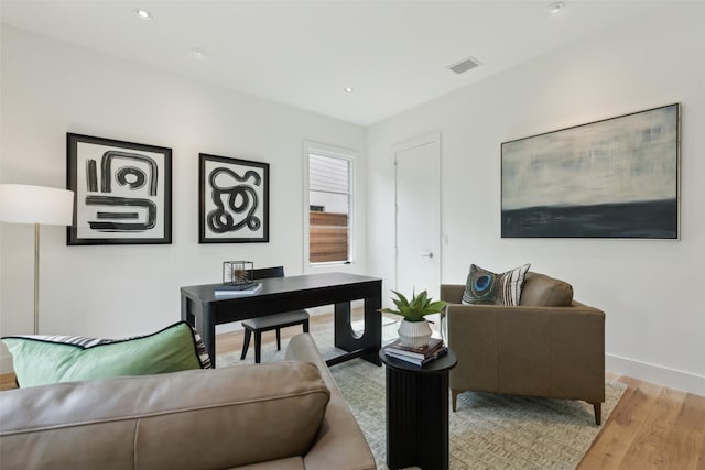home office with recessed lighting, baseboards, visible vents, and wood finished floors