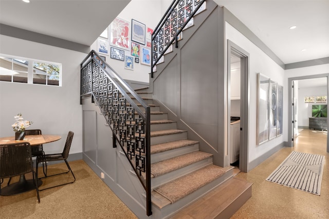 stairs with baseboards, speckled floor, and recessed lighting