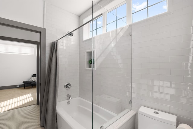 full bathroom featuring shower / bath combination with curtain and toilet