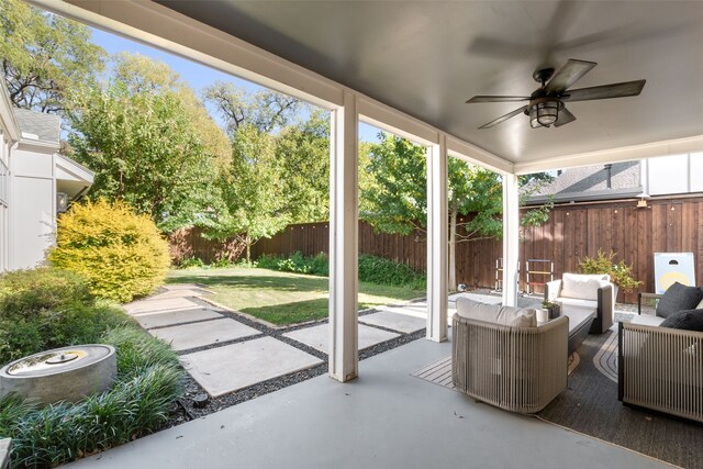 view of patio / terrace featuring a ceiling fan, fence private yard, and an outdoor living space