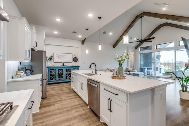 kitchen featuring a sink, white cabinetry, light wood-style flooring, and dishwasher