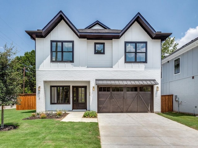 modern farmhouse featuring driveway, fence, board and batten siding, a front lawn, and a garage