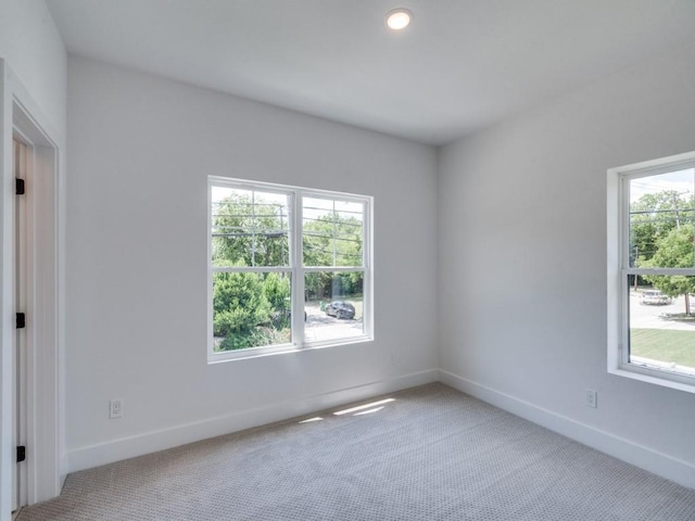 carpeted spare room with baseboards and recessed lighting