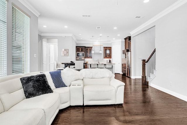3627 Harvest Ln, Frisco, TX 75034 - living area featuring dark wood-style flooring, stairs, recessed lighting, ornamental molding, and baseboards