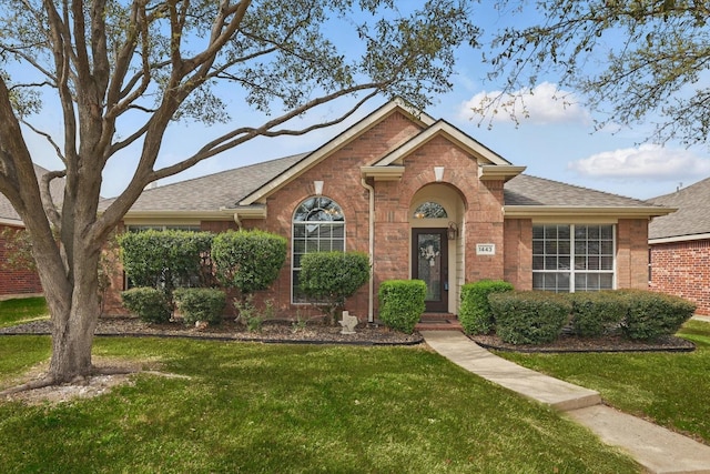 1443 Sleepy Hollow Dr, Allen, TX 75002 - ranch-style home with brick siding, roof with shingles, and a front yard