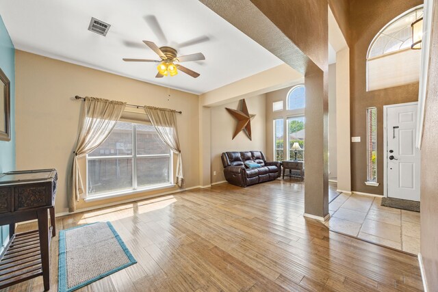7113 Raintree Way, Denton, TX 76210 - foyer featuring baseboards, ceiling fan, wood-type flooring, and visible vents