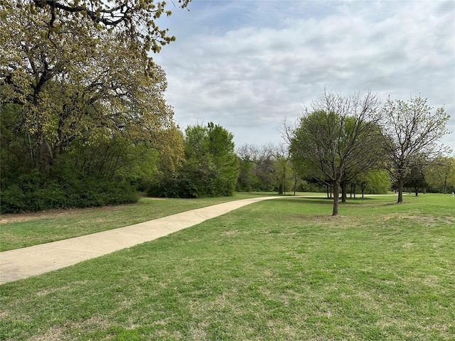 surrounding community featuring a yard