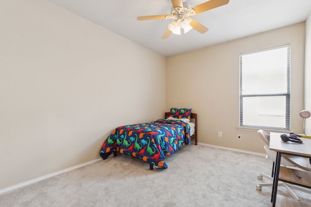 bedroom featuring baseboards, ceiling fan, and carpet flooring