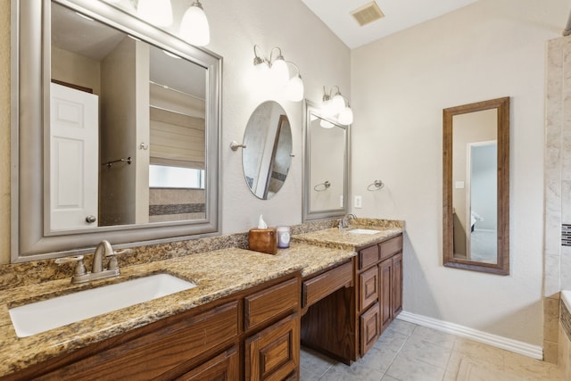 full bath featuring double vanity, a sink, baseboards, and visible vents