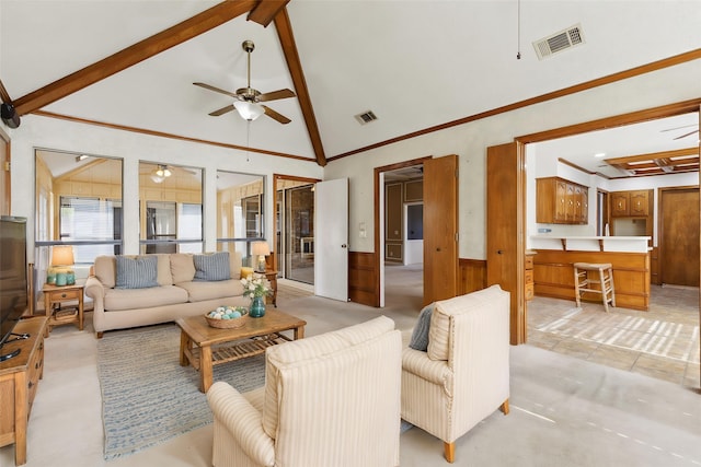 living room featuring ceiling fan, beamed ceiling, wainscoting, high vaulted ceiling, and light carpet