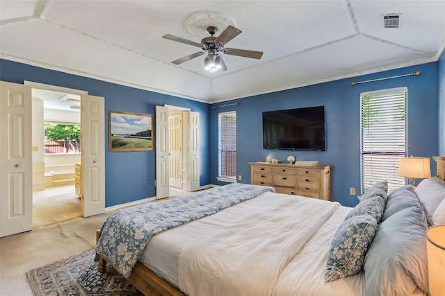 carpeted bedroom featuring multiple windows, ceiling fan, and vaulted ceiling