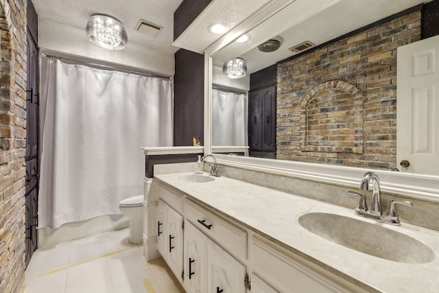 full bath featuring brick wall, tile patterned flooring, double vanity, toilet, and shower / tub combo with curtain