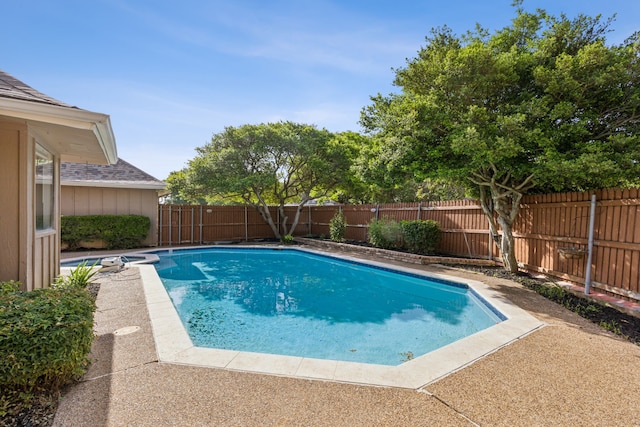 view of pool with a fenced backyard