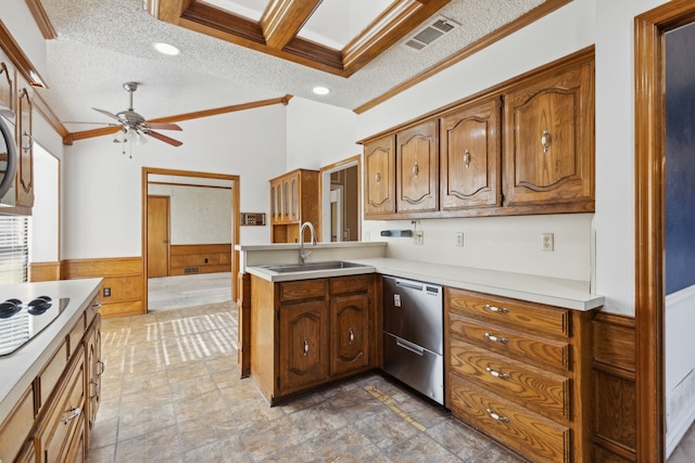 kitchen featuring dishwasher, a sink, ornamental molding, light countertops, and a ceiling fan