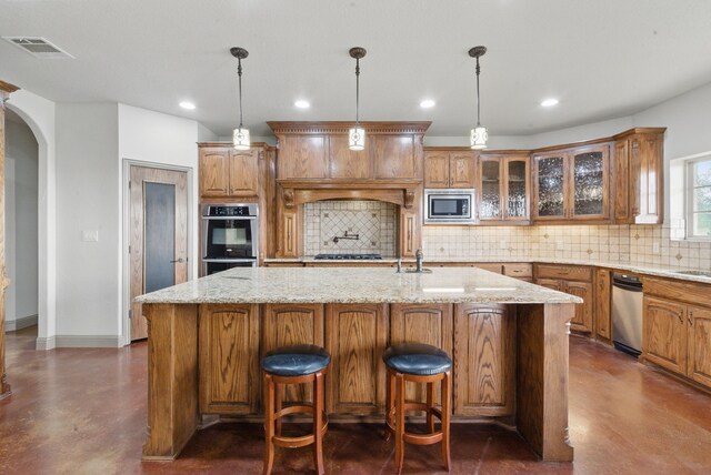 kitchen with concrete floors, stainless steel appliances, decorative backsplash, visible vents, and glass insert cabinets