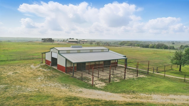 exterior space with an exterior structure, an outdoor structure, and a rural view